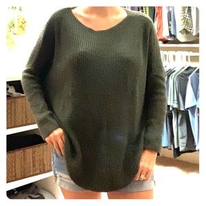 Open sides green sweater. Bought in Paris